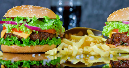 Delicious Burger Feast, Hearty American Style Cheeseburgers Served With Crispy Fries And Fresh...