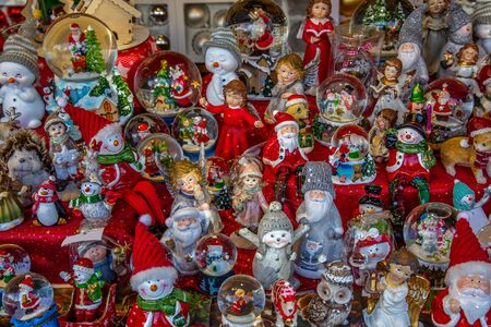 Variety of tiny Christmas figures in a market stand on a German Christmas marketの写真素材