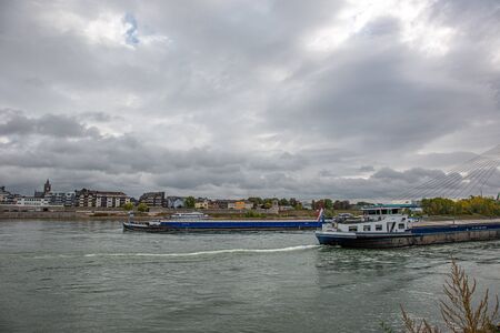 two blue transport ships on the river rhine in front of the city of Neuwied