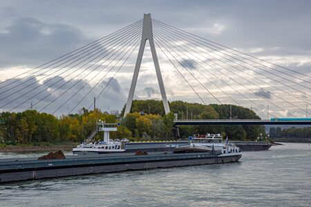 two transport ships in front of the bridge across the river rhine close to the city of Neuwiedのeditorial素材