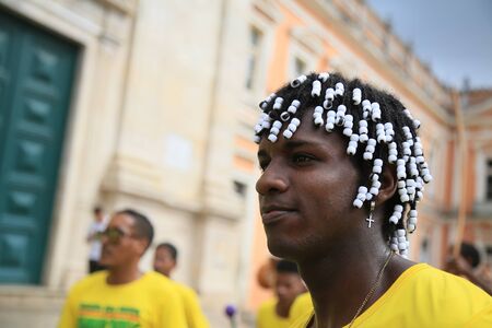 SALVADOR, BAHIA / BRAZIL - Nov. 20, 2019: Black man with braids in hair is seen during festivities in honor of Black Awareness Day. (Joa Souza).のeditorial素材