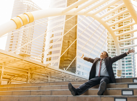 Business man with success feeling in the cityの写真素材