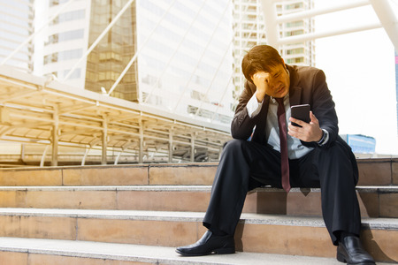 Business man with worry feeling in the cityの写真素材