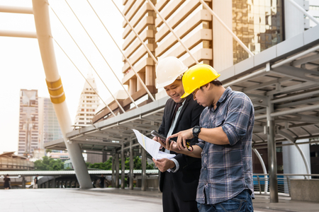 Leader and worker are work together in the cityの写真素材