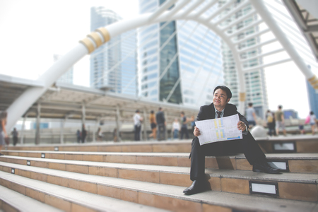 Business man with success feeling in the city with vintage styleの写真素材