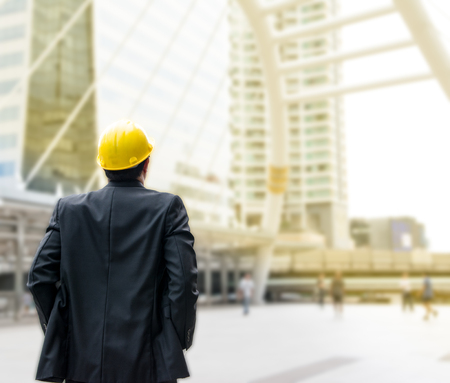 Business man focus on building in the city for success feeling with copy spaceの写真素材