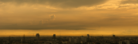 Blured cityscape of city during  sunset with golden lightの写真素材