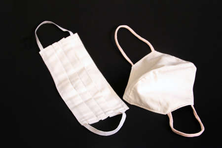 Two styles of diy protective masks for covid-19 on blackの写真素材