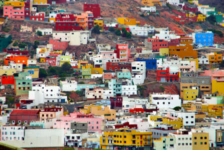 a lot of houses next to each other of a colorfull villageの写真素材
