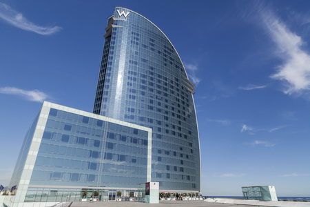 BARCELONA,SPAIN-NOVEMBER 26,2011: Modern architecture, Hotel W or Hotel Vela, by architect Ricard Bofill, in Barceloneta quarter, iconic building in the skyline of the city. Barcelona.のeditorial素材