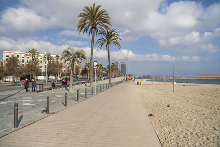 BARCELONA,SPAIN-DECEMBER 9,2015: Beach of Barceloneta and promenade maritime, Barcelona.のeditorial素材