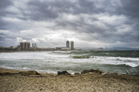 Barceloneta beach, shoreline of the city in a storm day, Barcelona.のeditorial素材