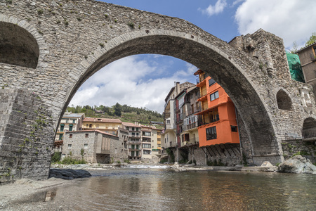CAMPRODON,SPAIN-MAY 14,2012: Ancient bridge, Pont Nou in pyrenees village of Camprodon, province Girona, Catalonia.のeditorial素材