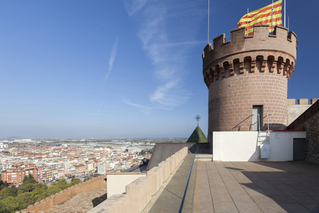 CASTELLDEFELS,SPAIN-SEPTEMBER 11,2016: Castle of Castelldefels, tower, catalan flag and city view, province Barcelona, Catalonia.のeditorial素材