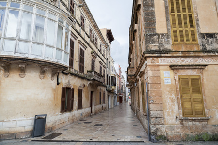 CIUTADELLA,SPAIN- JANUARY 22,2017: Narrow street and colored buildings,historic area,Menorca...