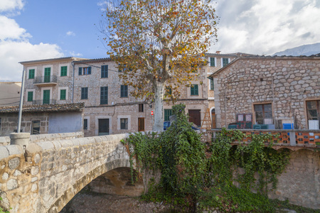 SOLLER,SPAIN-NOVEMBER 29,2016: Village view, traditional houses and old bridge, Soller, Balearic...