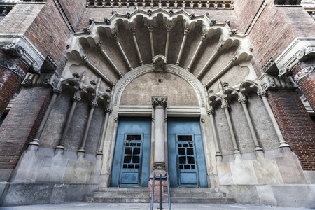 BARCELONA,SPAIN-NOVEMBER 13,2015: Architecture, religious building, church facade entrance of Hospital de la Santa Creu i Sant Pau, modernist building by obra de Lluis Domenech i Montaner. Barcelona.のeditorial素材