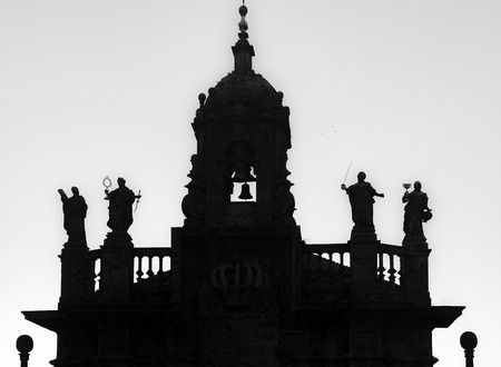 SANTIAGO DE COMPOSTELA,SPAIN-NOVEMBER 11,2015: Silhouette church.Iglesia de San Fructuoso. Baroque style. Bel tower and statues of the four cardinal virtues.Santiago de Compostela, Galicia, Spain.のeditorial素材