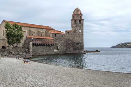 COLLIOURE,FRANCE- JUNE 17,2011: View of village Collioure in Cote Vermeille coast. Tower and church.のeditorial素材