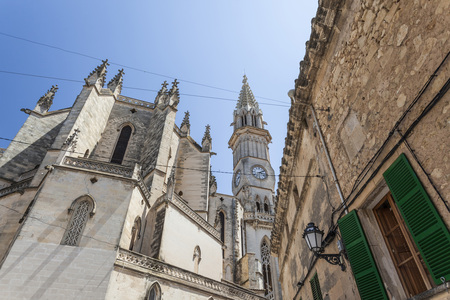 MANACOR,SPAIN-JUNE 4,2014: Village view, facade building and tower church, historic center of Manacor, Mallorca Island, Balearic Islands.のeditorial素材