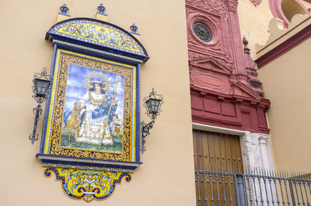 SEVILLE,SPAIN-SEPTEMBER 25,2013: Religious image and church in Triana quarter.のeditorial素材