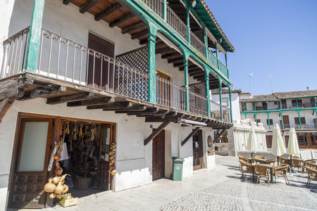 CHINCHON,SPAIN-JULY 24,2015: Square, Plaza Mayor, wooden balconies and shop in the village of Chinchon, province Madrid, Spain.のeditorial素材