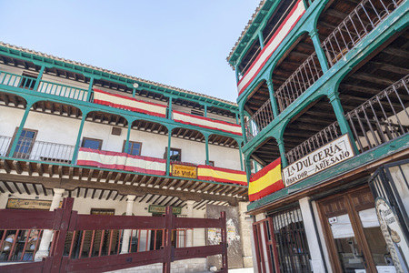 CHINCHON,SPAIN-JULY 24,2015: Square, Plaza Mayor, typical houses decorated with spanish flags in the village of Chinchon, province Madrid, Spain.のeditorial素材