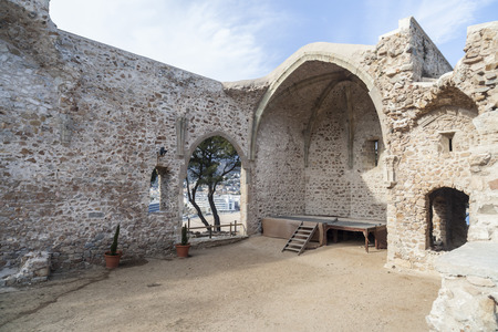 TOSSA DE MAR,SPAIN-MARCH 10,2015: Ancient ruins old church Sant Vicens, gothic style in Tossa de Mar, historic center, vila vella, mediterranean village in Costa Brava, province Girona, Catalonia.のeditorial素材