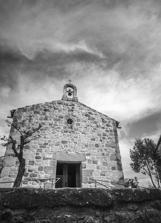 PRATS DE LLUSANES,SPAIN-MARCH 9,2015: Ancient chapel, romanesque style, capella de la bona sort, chapel good luck, black and white, Prats de Llusanes,province Barcelona,Catalonia.のeditorial素材