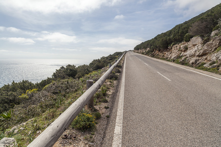 Road and sea view in Capo Caccia, Sardinia, Italy.の写真素材
