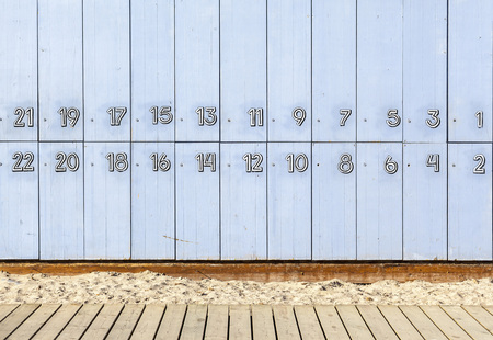 Blue lockers beach, numbered 1 to 22.の写真素材
