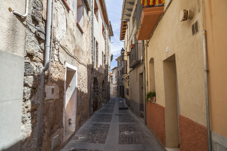 CASTELLFOLLIT DE LA ROCA,SPAIN-MAY 17,2017:Narrow street in village of Castellfollit de la Roca,Catalonia,Spain.のeditorial素材