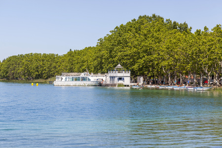 BANYOLES,SPAIN-MARCH 20,2017:Landscape lake with old and typical fishing houses named pesqueres  in Banyoles,Catalonia,Spain.のeditorial素材
