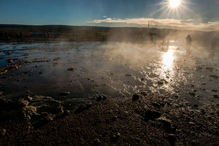 The Geysir area in Iceland is full of puddles with very high temperature water emitting sulfur-smelling water vaporの写真素材