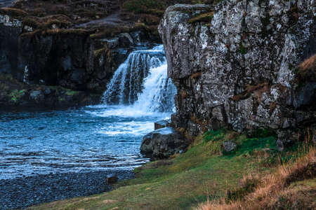 Kirkjufellfoss waterfall in the town of Grundarfjorur in western Iceland