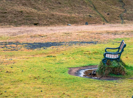 A bench to contemplate selfjalandsfoss one of the most beautiful waterfalls in all of icelandの写真素材