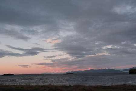Snowy mountains at sunrise from Hofn in South East Iceland