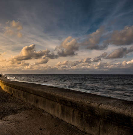 El Malecon promenade in Havana, Cuba, at sunsetの写真素材
