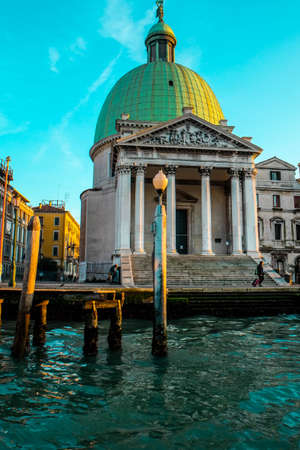 On the vaporetto along the Grand Canal towards the center of Venice at sunsetの写真素材