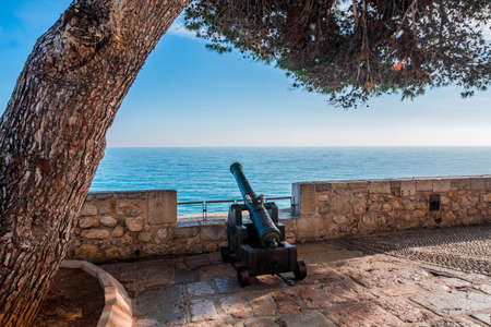 A defense cannon in the old wall of PeÃ±iscola in the Spanish Mediterraneanの写真素材