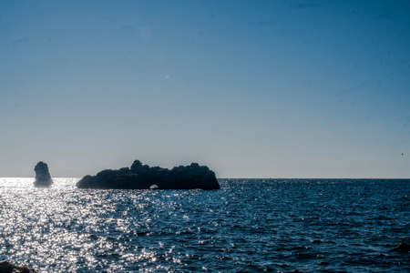 The rocky coast of the ancient island of Tabarca, in the Spanish Mediterranean, in front of Santa Pola, Alicanteの写真素材