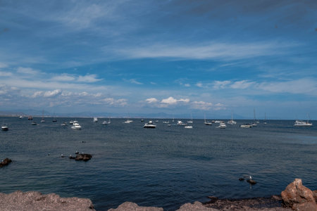 Boats anchored in the crystal clear waters of the island of Tabarca, in front of Santa Pola in the...