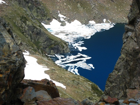 Ice Melting in a blue lake of high mountains の写真素材