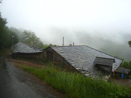 Slate Roof of an ancient house among the mist の写真素材