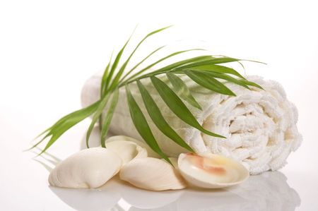 summer bath scene. towel, shell, leaf isolated on the white backgroundの写真素材