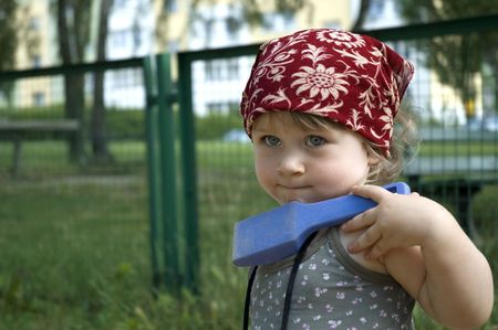 little cute girl playing at the playgroundの写真素材