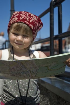 little girl with a city map. Gdansk. Polandの写真素材