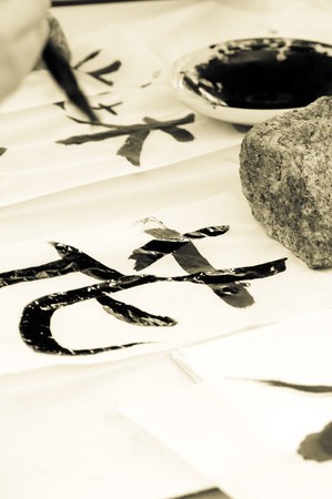 Teacher Helping Student drawing hieroglyph の写真素材