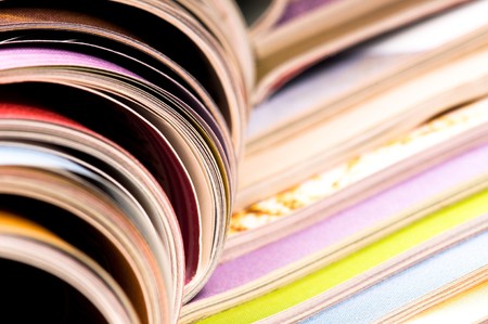 Stack of open magazinesの写真素材