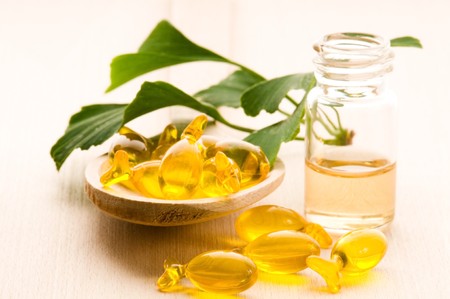 ginko biloba essential oil with fresh leaves - beauty treatment の写真素材